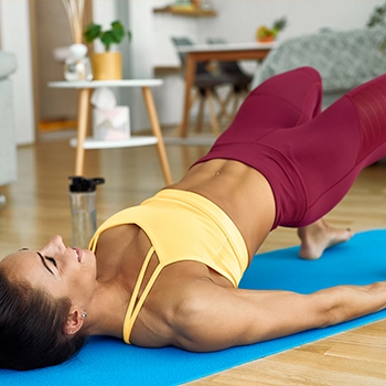 A woman holding her abdominal muscle for her core