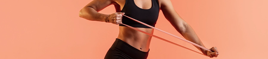 Woman pulling a resistance band for her workout