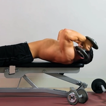 Man holding dumbbells performing rolling dumbbell triceps extension