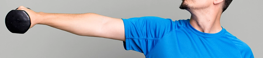 A man performing forearm dumbbell exercises