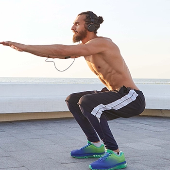 Performing air squats on rooftop