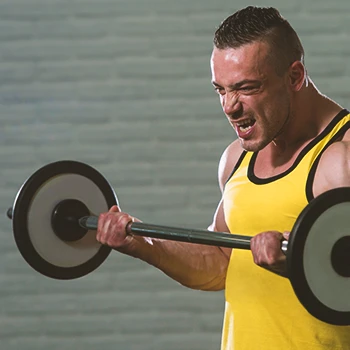 A person doing bicep curls in the gym