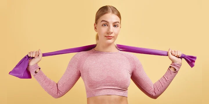 Fit person holding a power band