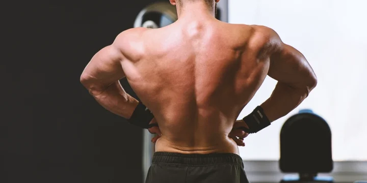 A person showing his back muscles