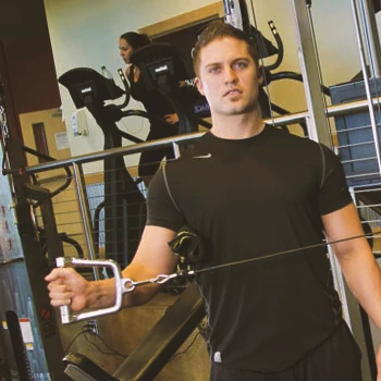 A man doing cable external rotation workouts