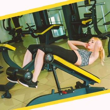 A woman doing a decline crunch on a bench for ab exercises