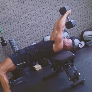 A person doing dumbbell pullovers