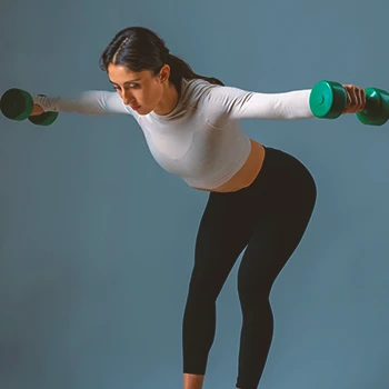 A woman doing dumbbell reverse flys