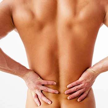 Holding back to stretch and relieve back pain