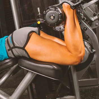 A woman doing leg curls in the gym