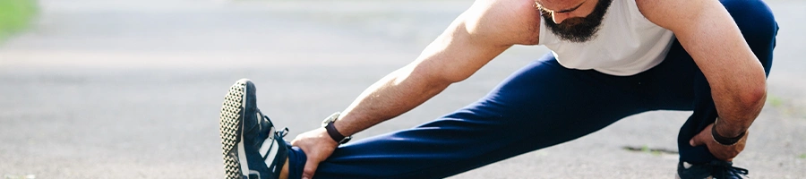 Person stretching legs outdoors