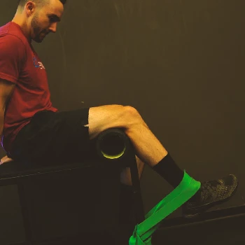A person doing Single-Leg Extension Isometric Holds
