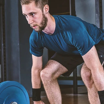 A person doing weightlifting in the gym