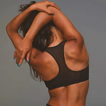 A woman stretching her back muscles
