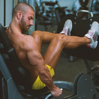 A person doing a leg press in the gym