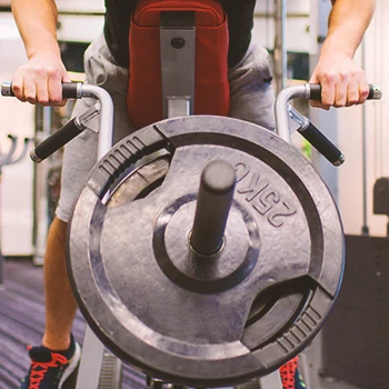 A person working out their back in the gym