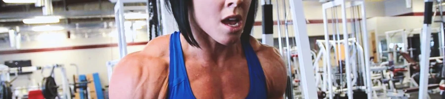 Dana Linn Bailey doing shoulder workouts in the gym