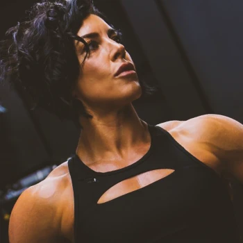 Dana Linn Bailey posing in the gym