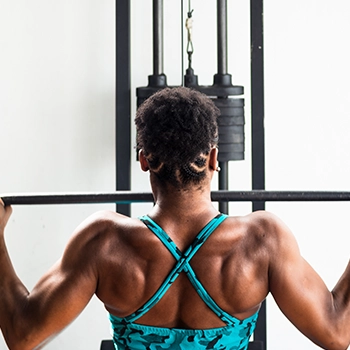 Performing cable lat pulldown