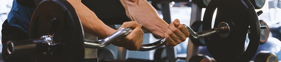 A man in the gym working out for bodybuilding