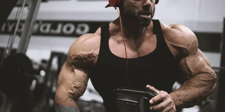 Frank Mcgrath in the gym working out his arms