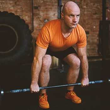 A person lifting weights in the gym