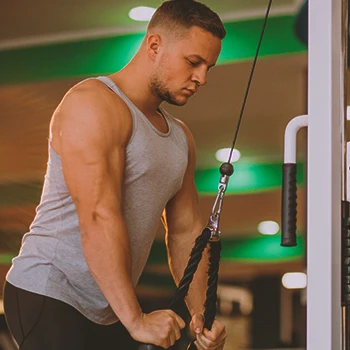 A person working out with a cable machine