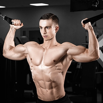 Man with great muscles doing chest exercises