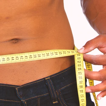 A person measuring his body with a tape