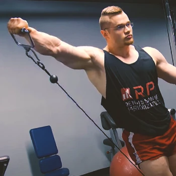 A person doing a leaning cable lateral raise