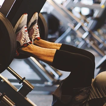 A person in the gym doing a leg press