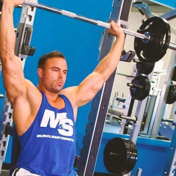 A person doing an overhead shoulder press