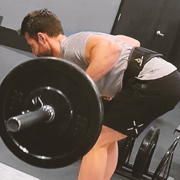 A man doing Pendlay Rows