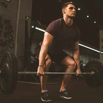 A person lifting weights in the gym