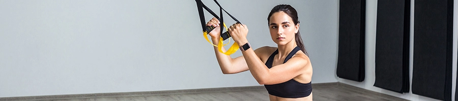 Woman doing suspension training