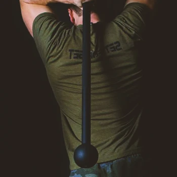A person working out with a steel mace
