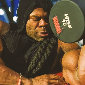 Kai Greene doing arm workout in the gym