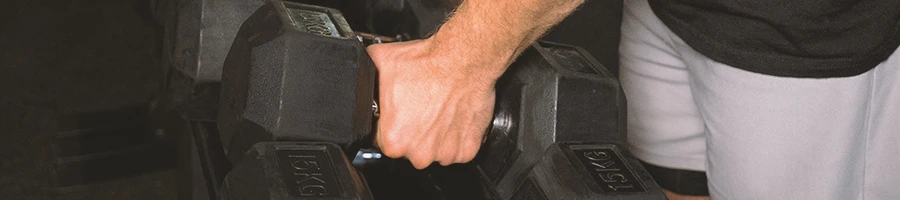 A person is doing a dumbbell upright row exercise