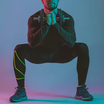 A person doing sumo squats for leg muscless