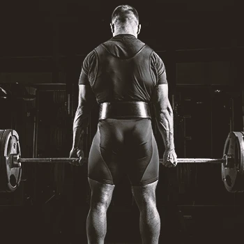 A buff male doing deadlifts for back muscles