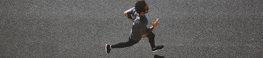 Top view of a runner jogging outside