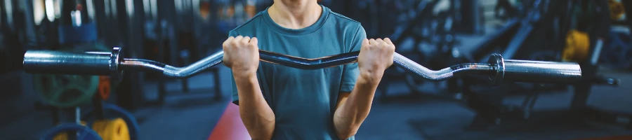 A young teenager working out in the gym