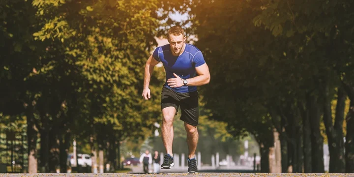 A runner running outside for strength training
