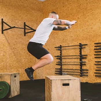 A person doing box jump burpees