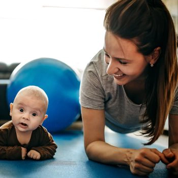 Woman exercising with a baby