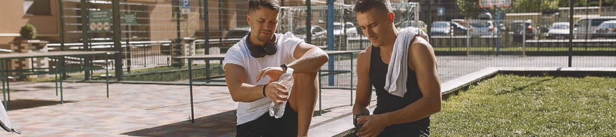 Two buff male planning an outdoor workout