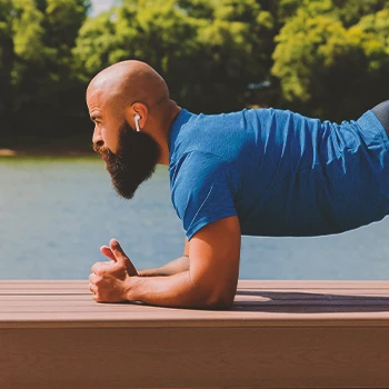 A person doing planks outside