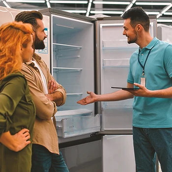 A couple buying a fridge for a home gym