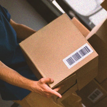 A delivery guy holding boxes