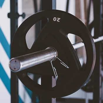Close up shot of barbell weights on a rack